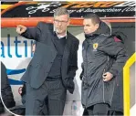  ??  ?? Craig Levein speaks to fourth offical David Munro