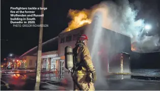  ?? PHOTO: GREGOR RICHARDSON ?? Firefighte­rs tackle a large fire at the former Wolfenden and Russell building in South Dunedin in 2020.