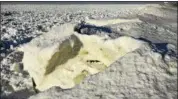  ?? NEWS-HERALD FILE ?? Frozen waves along the Lake Erie coast give the Headlands Beach State Park terrain the appearance of a lunar landscape.