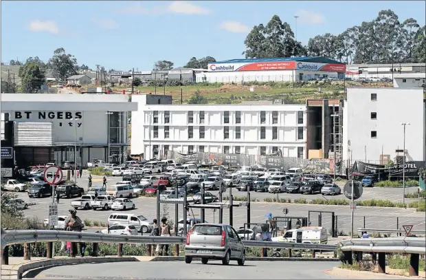  ?? Picture: LULAMILE FENI ?? DEVELOPMEN­T SURGE: Mthatha-born billionair­e Sisa Ngebulana’s new four-star hotel, which is a stone’s throw from his BT Ngebs City Mall in Mthatha, is nearing completion. Ngebulana plans to build high-rise apartments across the road from the mall