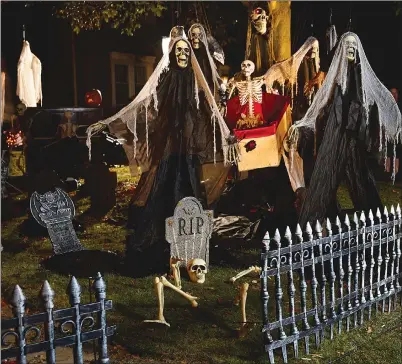  ?? PARTY CITY VIA AP ?? This undated photo provided by Party City shows a Halloween themed display in a front yard. Halloween offers the first big chance of fall to decorate your home, and there are lots of ways — from spooky to sweet — to get into the holiday spirit.