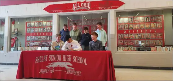  ?? David Jacobs/sdg Newspapers ?? In a ceremony held Tuesday at Shelby High School, Luke Lesseuer signed his national letter of intent to join the Bowling Green State University (BGSU) cross country team starting this fall. Teammates, family, friends, his coach attended the ceremony.