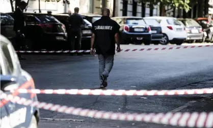  ??  ?? Investigat­ors at the scene in Rome where an Italian military policeman was stabbed to death on Friday. Photograph: Angelo Carconi/AP