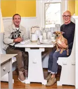  ?? COURTESY PHOTO ?? Interior designers Paul Rochford and Michael Violante take a break in the breakfast nook of The Store, their home furnishing­s retail space inside an 1906 Craftsman house.