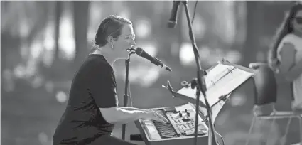  ??  ?? Candace Fish performs a song during an interfaith prayer service for Afghanista­n on Tuesday.