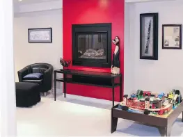  ?? GLADWIN DESIGN-BUILD-RENOVATE ?? The renovated basement at 14 Zokol Cres. features a dramatic red wall. Gladwin crafted dedicated spaces including a home theatre, games area, bar, fitness studio, and powder room.