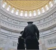  ?? REUTERS ?? Police officers stand in the Rotunda at the US Capitol in Washington, DC on Friday.