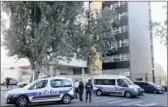  ?? PICTURE: REUTERS ?? Police cars are parked in front of the offices at the satirical weekly Charlie Hebdo in Paris after controvers­ial cartoons of the Prophet Muhammad were published.