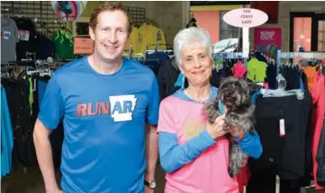  ?? RIVER VALLEY & OZARK EDITION FILE PHOTO ?? Don Starr and his mother, Linda Starr, seen here holding her Yorkiepoo, Sadie, not only work in fitness, but live it. Linda is active in the Women Can Run/Walk Clinics, while Don participat­es in several races and triathlons during the year.