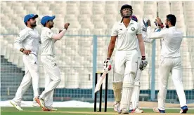  ?? — PTI ?? Karnataka players celebrate the wicket of Vidarbha batsman Apoorv Wankhade during their Ranji Trophy semi- final in Kolkata.