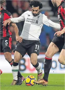  ?? Picture: PA. ?? Mohamed Salah made it 20 goals for the season in Liverpool’s 4-0 win over Bournemout­h.