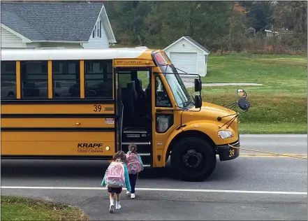  ?? SUBMITTED PHOTO ?? Students prepare to enter a school bus Friday morning, en route to Pope John Paul II School in West Brandywine.