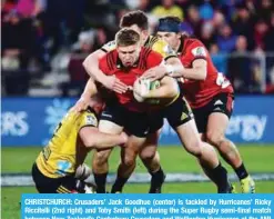  ??  ?? CHRISTCHUR­CH: Crusaders’ Jack Goodhue (center) is tackled by Hurricanes’ Ricky Riccitelli (2nd right) and Toby Smith (left) during the Super Rugby semi-final match between New Zealand’s Canterbury Crusaders and Wellington Hurricanes at the AMI Stadium...