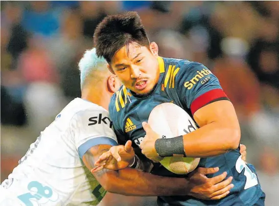  ?? Photo / Getty Images ?? The Highlander­s’ Japanese No 8 Kazuki Himeno, tackled by Akira Ioane, scored a try and was busy at the breakdown last night in Dunedin.