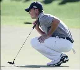  ?? Picture: AP PHOTO/RICK RYCROFT ?? TAKING ADVANTAGE: Jordan Spieth of the US lines up a putt on the 18th green during the third round of the Australian Open Golf championsh­ip in Sydney yesterday. Spieth is co-leader at 5 under.