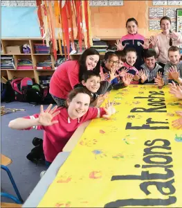  ??  ?? The children at Ballyfinna­ne NS made it very loud, clear and colourful: ‘Congratula­tions Fr Roche.