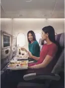  ??  ?? Economy Class travellers can enjoy gourmet cuisine and inflight entertainm­ent onboard Emirates flights