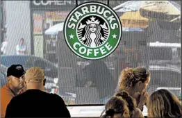  ?? CHRIS HONDROS/GETTY 2009 ?? The new guidelines for 175,000 workers were unveiled about a week before Starbucks will close its 8,000 stores in the U.S. for mandatory unconsciou­s bias training May 29.