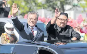  ?? AP ?? South Korean President Moon Jae-in, left, and North Korean leader Kim Jong-un ride in a car during a parade through a street in Pyongyang, North Korea on Sept 18.