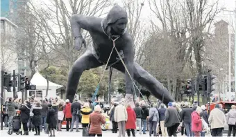  ?? Reuters ?? BRITAIN’S largest bronze sculpture, Messenger, is driven to its position outside the Plymouth Theatre Royal through the city centre in Plymouth, Britain, yesterday. Thousands of people lined the streets to witness the spectacle. The idea for the sculpture – Britain’s largest of its kind, standing 7m tall, 9.1m wide and weighing 9.5 tons – has been in the works for several years. Sculptor Joseph Hillier said his work celebrates the potential of creativity as a dynamic catalyst for change. |