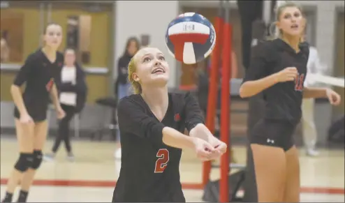  ?? Dave Stewart / Hearst Connecticu­t Media ?? New Canaan’s Elle Sneddon (2) hits a pass during a girls volleyball match against Trumbull in New Canaan on Oct. 3.