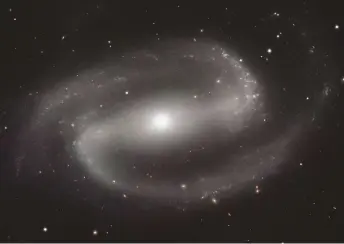  ??  ?? The model accounts for why some barred spiral galaxies show intense star formation but others are quieter