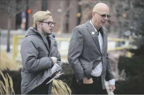  ?? AP PHOTO/DAVID ZALUBOWSKI ?? Michael Anderson (left) a survivor of the mass shooting at Club Q, walks with the club’s co-owner, Matthew Haynes, into the El Paso County courthouse for a preliminar­y hearing for Anderson Lee Aldrich, the alleged shooter in the Club Q mass shooting on Wednesday in Colorado Springs, Colo.