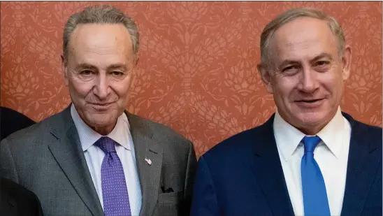  ?? MANUEL BALCE CENETA, FILE — THE ASSOCIATED PRESS ?? Israeli Prime Minister Benjamin Netanyahu, right, poses for a picture with Senate Minority Leader Chuck Schumer of New York, on Capitol Hill in Washington in 2017. Schumer is calling on Israel to hold new elections.