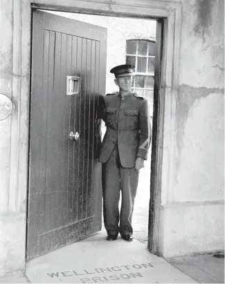  ?? Photo: ALEXANDER TURNBULL LIBRARY REF: 114/104/05/24-F ?? A guard at Mt Crawford Prison on the Miramar peninsula in January 1950. It was the last jail in Wellington to execute prisoners.