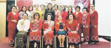  ??  ?? Senorita (seated centre) and several members of SIDS with the event organising committee during a photo call.