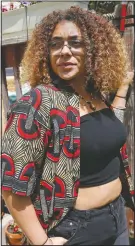  ?? (AP/Jim Mone) ?? Tachianna Charpenter, 21, stands for a portrait at her St. Paul, Minn., home on June 12. Charpenter joined demonstrat­ors in Minneapoli­s multiple times in the wake of George Floyd’s death on Memorial Day. She grew up in Duquette, Minn., a town with a population of less than 100 in the predominan­tly-white northern region of the state. Charpenter, who is mixed-race, said she continuous­ly encountere­d subtle instances of racism as the only black child in her school.