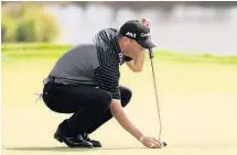  ?? MIKE EHRMANN/GETTY IMAGES ?? Ryan Palmer lines up a putt on the first green during the second round of The Honda Classic at PGA National Resort and Spa on Friday.