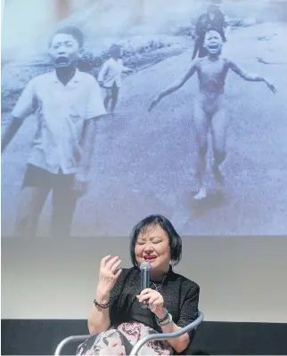  ?? PHIL CARPENTER ?? Kim Phuc, the Vietnamese woman who was known the world over as the Napalm Girl from a photograph taken by Associated Press photograph­er Nick Ut in 1972, speaks Friday during a lecture at the Montreal Museum of Fine Arts. She spoke of how she overcame feelings of hate she felt for those who caused her injuries.