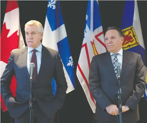  ?? PAUL DALY/THE CANADIAN PRESS ?? Newfoundla­nd’s Dwight Ball, left, and Quebec’s François Legault speak to the media during the Atlantic Premiers’ Conference in St. John’s Monday.