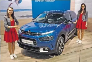  ?? BILDER: SN/GK (3) ?? Neuheiten des PSA-Konzerns in Wien: Der Citroën C4 Cactus als Weltpremie­re, der extrem flotte Peugeot 308 GTI und der stattliche DS7 Crossback (von rechts) .