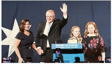  ?? — AFP ?? In the spotlight: Morrison and his family on stage in Sydney after winning the Australian general election.
