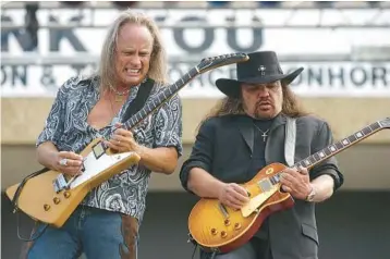  ?? STEVE TRAYNOR/KILLEEN DAILY HERALD ?? Rickey Medlocke, left, and Gary Rossington of Lynyrd Skynyrd perform in 2004.