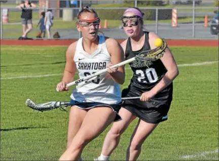  ?? STAN HUDY - SHUDY@DIGITALFIR­STMEDIA.COM ?? Saratoga’s Katie Wendell (23) looks to get control of the ball after beating Shenendeho­wa’s Bridget Shanahan (20) after securing the ground ball during Monday’s Section II Class A semifinal at Saratoga Springs High School.