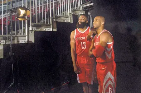  ?? Jon Shapley / Houston Chronicle ?? Rockets guards James Harden (13) and Chris Paul did plenty of smiling for the camera during media day Monday.