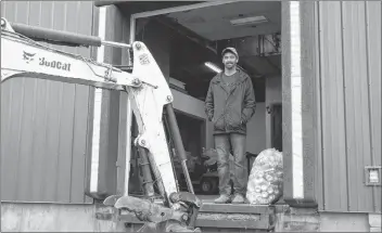  ?? LAWRENCE POWELL ?? MacKenzie Akin oversees work being done at the loading docks of the old co-op store in Lawrenceto­wn where Carleton Road Industries Associatio­n is opening a bottle exchange off Prince Street, Lawrenceto­wn. People will be able to back right up and offload bottles, cans, juice boxes and more. CRIA will operate a mobile bottle exchange in Middleton on Tuesdays as well.