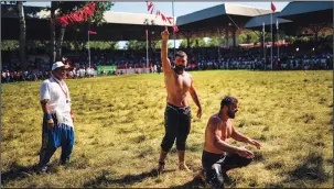  ?? ?? A wrestler celebrates as he competes in the championsh­ip.