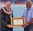  ?? Photo: Nicolette Chambers ?? USAID Pacific Islands Acting Senior Developmen­t Advisor, Patrick Bowers handing over the grant certificat­e to the University of Fiji’s Dean for the School of Humanities and Arts, Professor Tupeni Baba at the Saweni Campus in Lautoka.