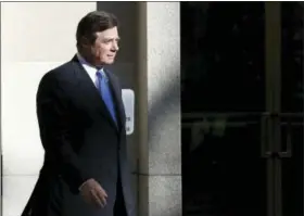  ?? THE ASSOCIATED PRESS ?? Paul Manafort walks from Federal District Court in Washington, Monday. Manafort, President Donald Trump’s former campaign chairman, and Manafort’s business associate Rick Gates pleaded not guilty to felony charges of conspiracy against the United...