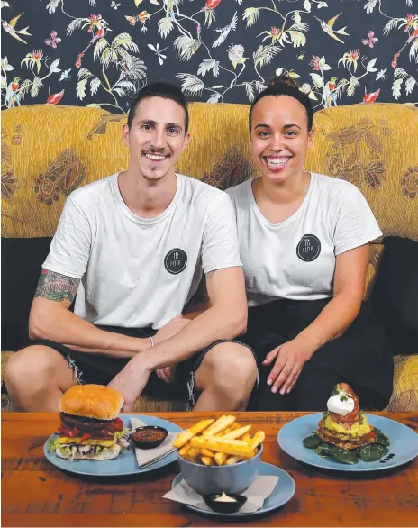  ?? Picture: David Clark ?? Shayne Green and Jess Kaimoana serve up home-style haloumi burgers and comforting corn fritters.