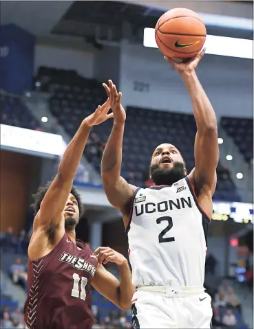  ?? Jessica Hill / Associated Press ?? UConn’s R.J. Cole (2) shoots past Maryland-Eastern Shore’s Kohen Thompson (11) on Tuesday in Hartford.