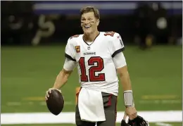  ?? BRETT DUKE — THE ASSOCIATED PRESS FILE ?? Tampa Bay Buccaneers quarterbac­k Tom Brady has agreed to a contract extension with the Buccaneers that provides the Super Bowl champions with much-needed salary cap relief and will help the seven-time NFL champion reach a goal of playing until he’s at least 45. Brady posted a picture of himself on Twitter, signing the extension on Friday with the message: “In pursuit of 8... LFG@ Buccaneers we’re keeping the band together.”