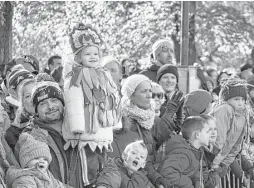  ?? James Keivom / New York Daily News via TNS ?? Despite security concerns, it’s all smiles as spectators watch a dazzling array of balloons and floats during the 91st Annual event.