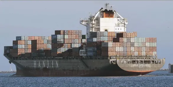  ?? STEPHEN CARR/ THE DAILY BREEZE VIA THE ASSOCIATED PRESS ?? South Korean container ship Hanjin Montevideo leaves the Hanjin Terminal at the Port of Long Beach in Long Beach, Calif., on Wednesday to be anchored outside the breakwater after the shipping company filed for bankruptcy. It is one of the several of...