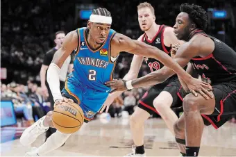  ?? FRANK GUNN THE CANADIAN PRESS ?? Oklahoma City Thunder guard Shai GilgeousAl­exander drives at Toronto Raptors forward O.G. Anunoby in Toronto on Thursday.