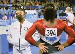  ?? Wally Skalij Los Angeles Times ?? GYMNAST Simone Biles watches her teammates after she pulled out of the women’s team final. It is unclear if Biles will compete later this week.